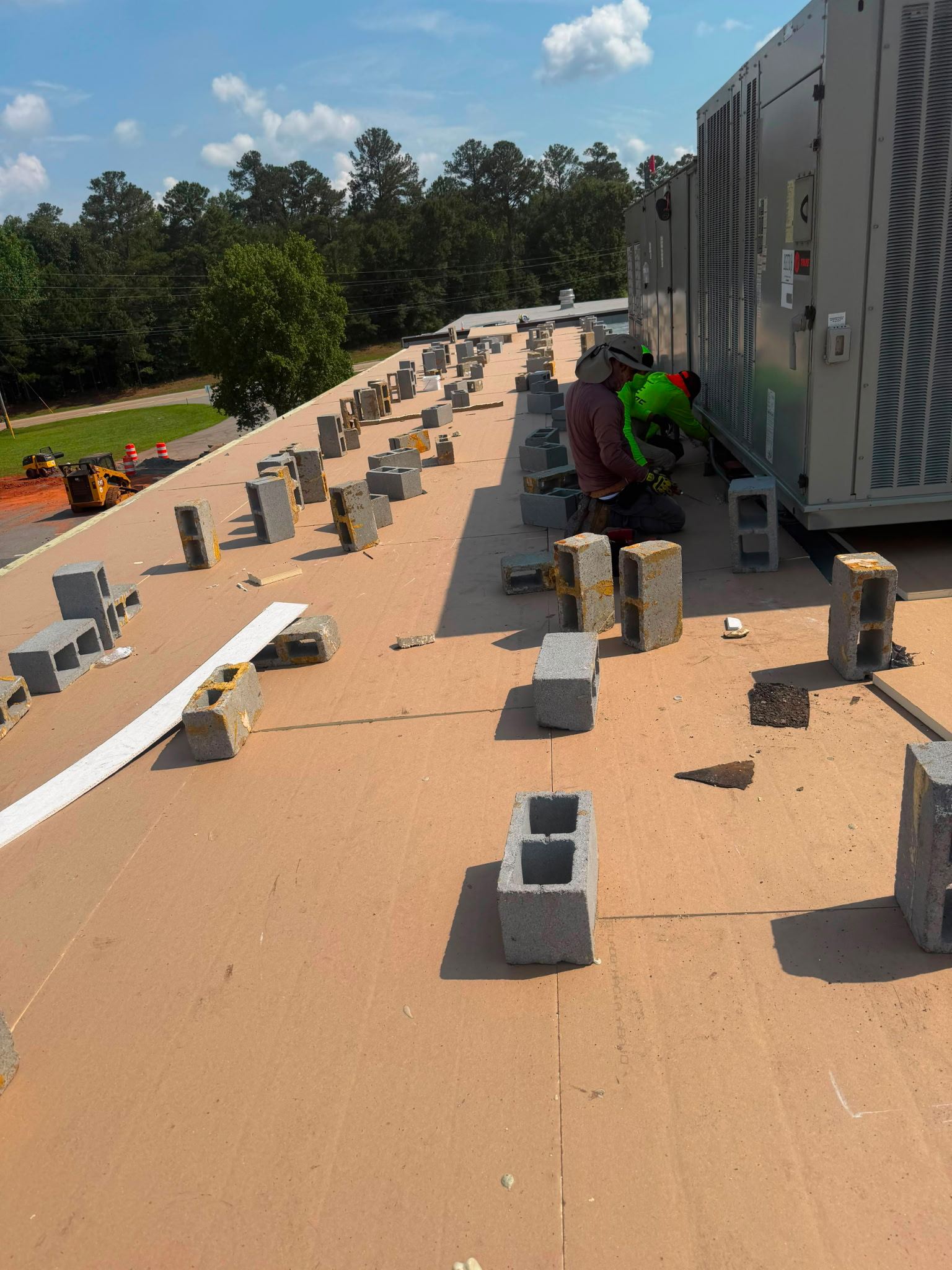 Right Now Services crew servicing a commercial rooftop HVAC unit