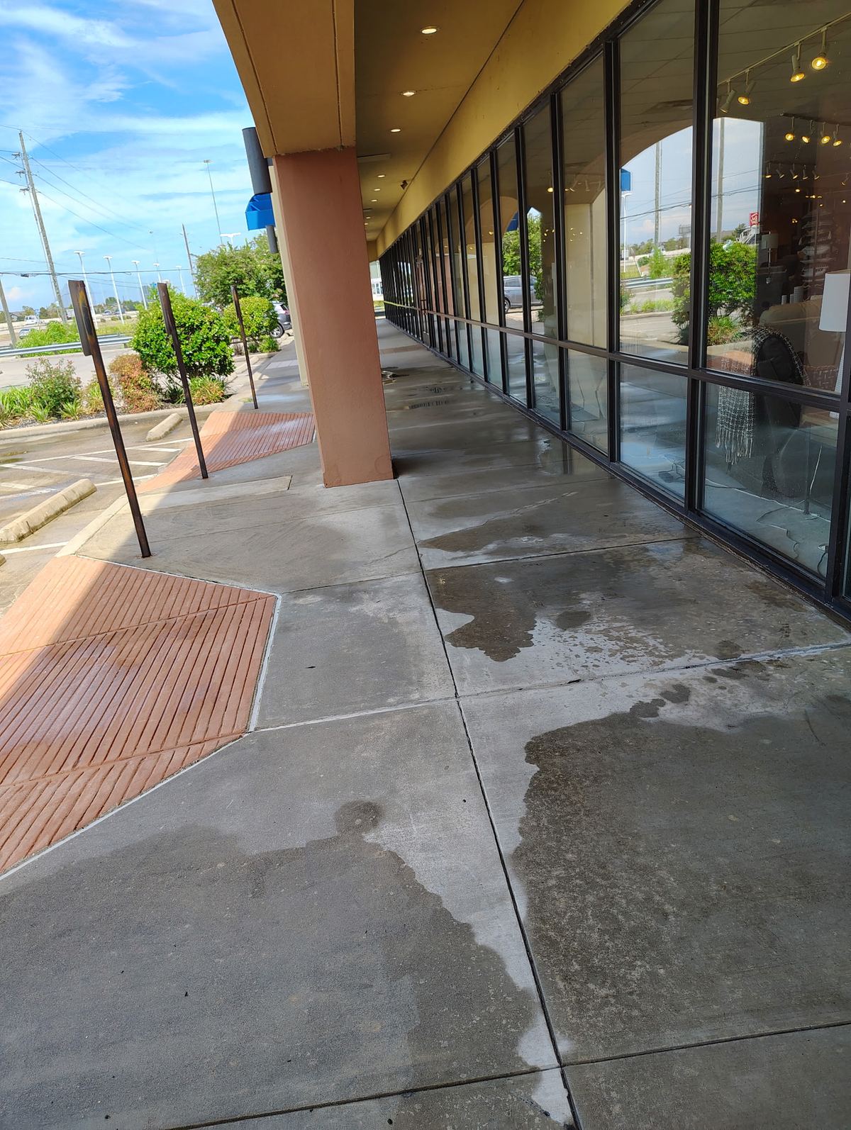 Freshly pressure-washed storefront sidewalk